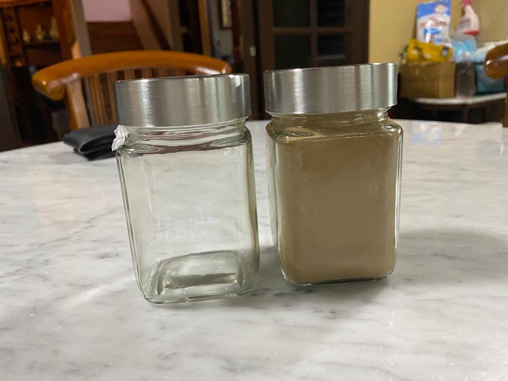 Pure agarwood powder in a glass jar